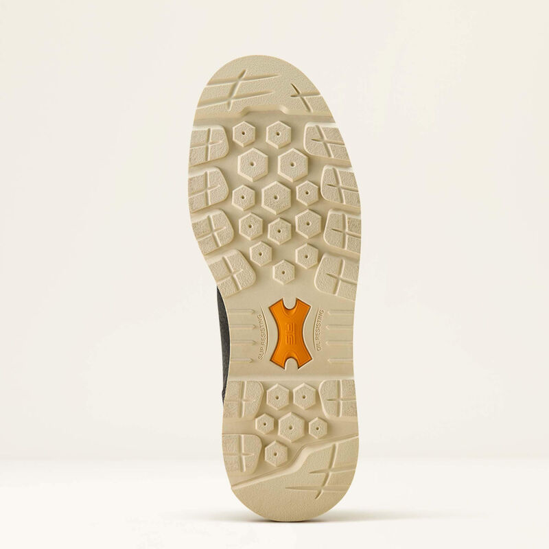 Close-up of a shoe sole with a brand logo on a light beige background